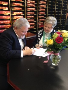 Senator Perry Clark, D-Louisville, files for re-election with the Secretary of State’s office. Assisting him is Mary Sue Helm.