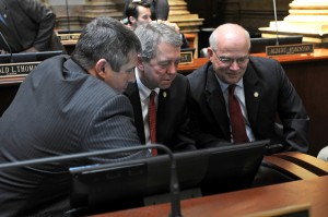 Even though the 2016 Legislative Session just convened last week -- on Tuesday, January 5 -- legislators are already hard at work. Above, Senate Democratic Floor Leader Ray S. Jones II (left), D-Pikeville, Senator Dorsey Ridley (center), D-Henderson, and Senator Dennis Parrett (right), D-Elizabethtown, research information pertaining to 2016 legislation while the Kentucky State Senate takes a brief recess. Among the work to be done during this 60-day session is the most daunting task of the General Assembly – the drafting of the state’s two-year budget. 