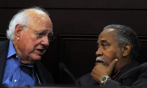 Senate Democratic Whip Julian M. Carroll, D-Frankfort, confers with Senate Democratic Caucus Chair Gerald A. Neal, D-Louisville, during the June meeting of the Interim Joint Committee on Veterans, Military Affairs, and Public Protection. 