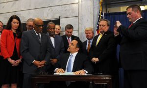 Senate Democratic Caucus Chair Gerald A. Neal, D-Louisville, joined Rep. Darryl Owens, Gov. Matt Bevin and other legislators on April 12 for the ceremonial bill signing for House Bill 40 – the felony expungement bill. 